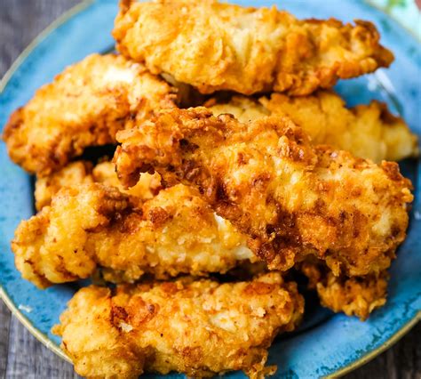 Best chicken tenders. Cut each chicken breast into 4-6 strips. Prepare the breading and batter into two separate bowls. Dip each piece of chicken into the breading then into the wet batter and then into the breading again. Shake off excess flour and repeat with the other chicken pieces. In a large pot or dutch oven heat oil to 350°F. 