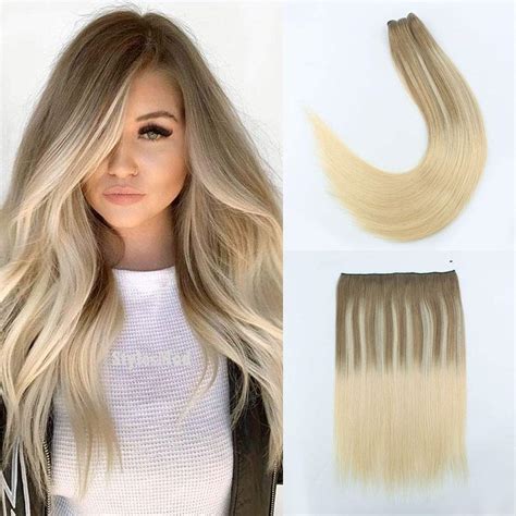 Best halo hair extensions. The Catherine 14" 90g Halo Human Hair Extension is made of 100% human hair. This extension does not tangle or shed. The length and weight of these comfortable halo hair extensions are suitable for people with a hair length of 15″ to 16″. The hair weight, the width of the weft, and wire length can be customized according to your needs. 