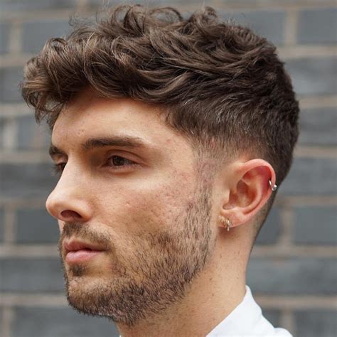 34. Pompadour with Fade. Save. The pompadour brown haircut for men is most suitable for men with long as the main styling and cut require voluminous hair at the top of the head. The haircut is done mainly from the top in a way that the hair is styled to stick up in a standing position.. Best men's hairstyles for thick hair