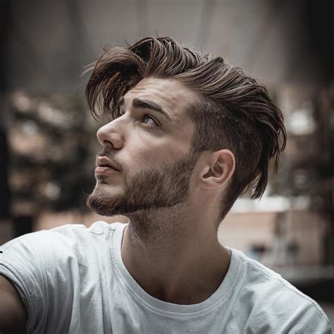 Best men haircuts. 3. Slicked Back. A perennial favourite among the suits, this is one of the best medium-length hairstyles for men who have thick, straight hair. True to its name, the slick back sends all your hairs in the same uniform direction, leaving no strand or split end behind. 