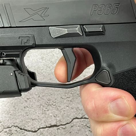 Recently I added the MCarbo trigger and spring upgrade to the TACOPS after both guns were well broken in. Recently, I picked up the p365 axg legion. It has the same foot print as the X-Macros BUT, the grip module is a metal allow and overall and 4 ounces heavier. There are cuts at the front of the slide and the shorter 3.1" barrel.