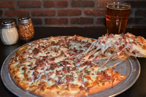 Best pizza in louisville ky. Jun 24, 2023 · This savory, sweet, and tangy pizza is an absolute Louisville favorite. 2. Garage Bar. 700 E Market St. Louisville, KY 40202. (502) 749-7100. Garage Bar is a stylish eatery in a former garage serving brick-oven pies and Southern fare. 
