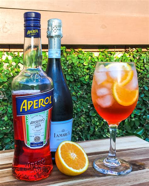 Best prosecco for aperol spritz. Step 1: Fill a large wine glass with ice – use full ice cubes or crushed ice, it’s really up to you!. Add the aperol and pomegranate juice and stir. Pour the prosecco into the glass and top with club soda. Step 2: Garnish with an orange wedge, a fresh sprig of rosemary and a pomegranate (arils) seeds. Enjoy! 