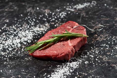 Best salt for steak. Using tongs, turn the steak on its sides to render the white fat and sear the edges (1-minute per edge). Reduce heat to medium and immediately add 2 Tbsp butter, quartered garlic cloves and rosemary to the pan. Spoon the butter sauce over the steak, tilting the pan to get butter on your spoon. 