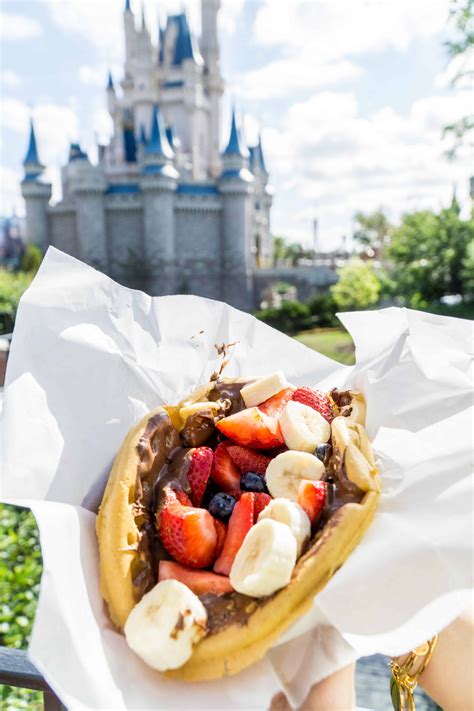 Best snacks at magic kingdom. Oct 13, 2023 · The breakfast morning wrap or the classic ronto wrap are both great snacks to try in Disney World. They both feature a soft pita wrap, delicious peppercorn sauce, and either egg and sausage or roasted pork. Try this item as a morning pick-me-up or afternoon snack. 9. Mickey Ice Cream Sandwich. 