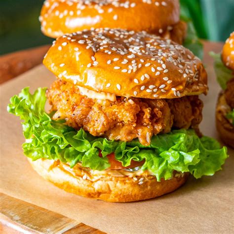 Best spicy chicken sandwich. Coat chicken in Gochujang sauce, place on the lightly toasted butter buns and top with spicy mayonnaise desired toppings such as pickles, green onions, Kimchi. 