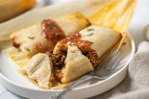 Best tamales. Spread it flat, making sure to leave some space around the edges. Put the filling in the center and then fold according to your recipe. You want to make sure the tamales are wrapped tightly enough ... 