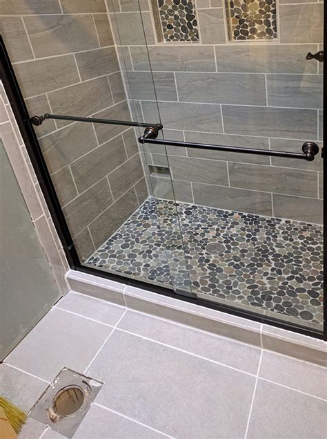 Best tile for shower floor. Make sure the joints around the tile are uniform, and the surface of the newly installed tile (s) are flush with the surrounding tiles. 5. Wait for the tile adhesive to dry and then grout the joints surrounding any new tiles you have installed. [6] Use a sponge and plenty of water to clean excess grout off the tile's surface. 