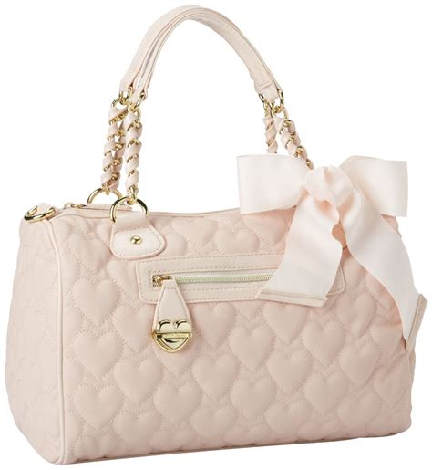Shop Women's Betsey Johnson Pink White Size OS Travel Bags at a discounted price at Poshmark. Description: Betsey Johnson Color: Blush Pink Quilted Roses with gold and pearl buckle bow XL All Weekender Duffle Travel Bag Large Interior with multi functional pockets & detachable adjustable strap All over Rose quilted exterior, back slip pocket …. 