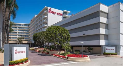 Beverly hilton. The Beverly Hilton was snuggled in a little triangle between Wilshire Boulevard and Santa Monica Boulevard, directly next to the Waldorf-Astoria. (The two hotels are so close, in fact, that people are frequently dropped off at … 