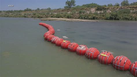 Biden administration sues Texas governor over Rio Grande buoy barrier that’s meant to stop migrants