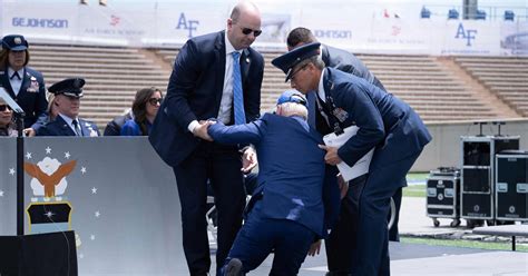 Biden falls on stage at Air Force graduation