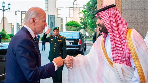 Biden gives Saudi Crown Prince Mohammed a hearty handshake a year after an awkward fist bump moment