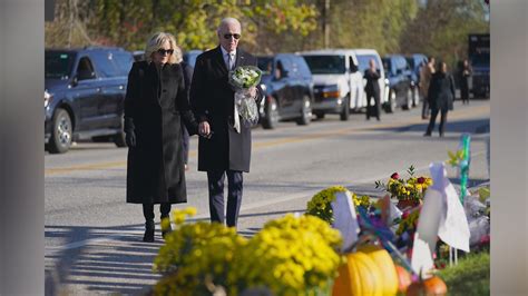 Biden places flowers outside bar where a gunman opened fire in Maine as he mourns with community