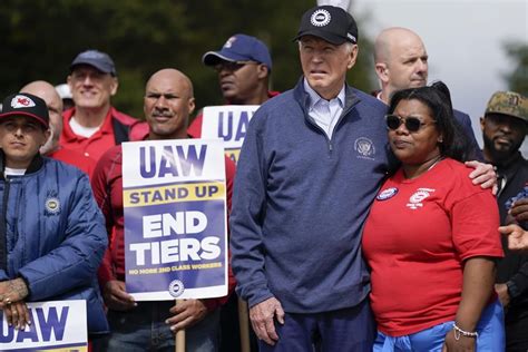 Biden urges striking auto workers to ‘stick with it’ in picket line visit unparalleled in history