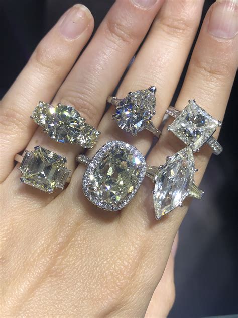 Big diamond rings. The design is set on a gold band, Meghan's favorite, made by royal jeweler Cleave and Company. Markle's engagement ring may be quite the contrast from Kate Middleton's 12-carat oval ring, but we ... 