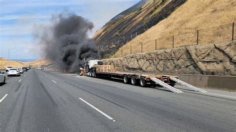 Big-rig fire on eastbound 580 in Livermore closes lanes, spreads to hillside