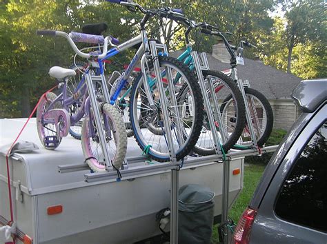 A pop-up camper bike rack doesn't have to be limited to just transporting bikes. You can also use the rack for: Extra storage space - Bungee cargo bags to the sides for overflow camping gear. Just check weight limits. Added seating - Attach a small folding stool to create an outdoor seating nook.. 