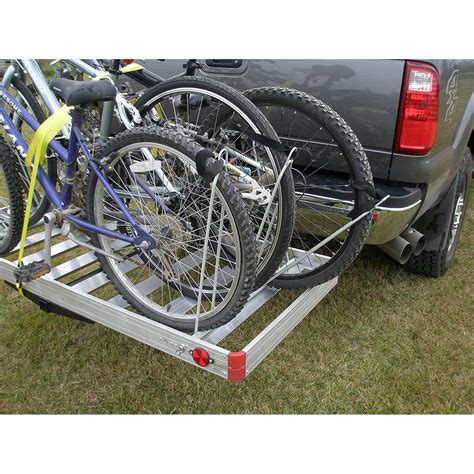 The hitch cargo carrier swing arm combination Cargo Carrier, Bike Rack, and Tailgater table also has built-in features that include provisions to add tubes for flag poles, an umbrella, or fishing rods, provisions for a multitude of tie-down locations, and pre-drilled holes for bottle openers, tools, and rotoPax.. 