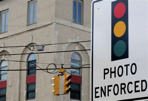 Bill would let cities, towns install red light cameras AP News