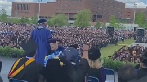 Billionaire Rob Hale surprises UMass Boston graduates with $1,000 and a challenge