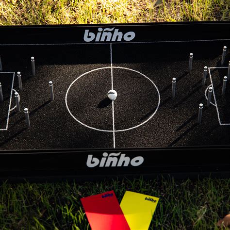 Binho board. A New Era: The Binho Classic is an upgraded, fully modular take on our original Binho Classic models with some major improvements to take your flicking game to another realm. Each game comes with 2 Binho balls, 2 scoring pieces, and 2 yellow/red playing cards and a Binho Rule Card all within a Binho box. Will start sh 