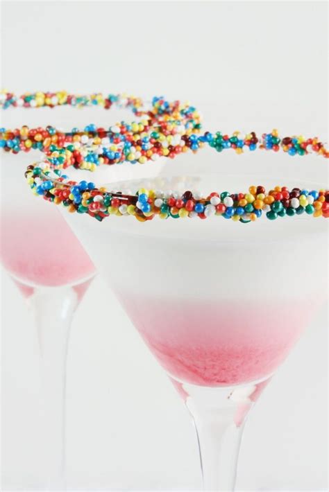 Birthday cocktails. Spread honey on rim of martini glass and dip in sprinkles. Pour Whipped Cream Vodka, White Chocolate Liqueur and Amaretto into cocktail shaker filled with ice. Shake until well-chilled. Strain into martini glass. 