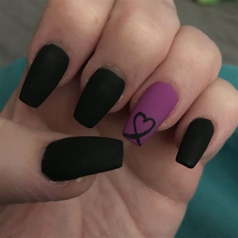 A mesmerizing ombre for your nails is a brilliant choice. Start with nude nail color and transit to a purple shade for the tips. 8. Acrylic Matte Coffin Nails. We guarantee you will adore these matte purple coffin nails. Create a coffin shape and your hands will look bold and classy. 9. Purple and Black Nails. 10.. 