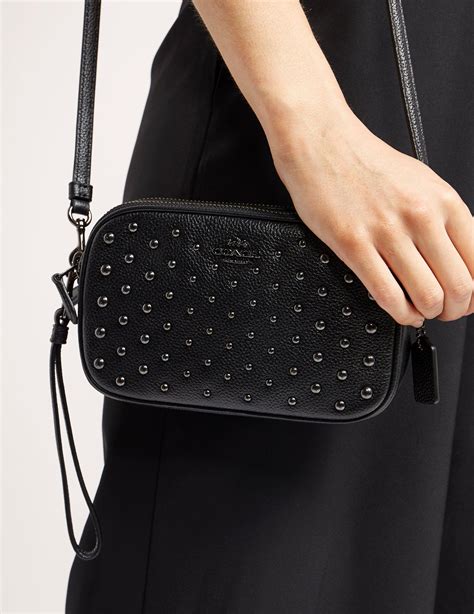 Black coach clutch. Things To Know About Black coach clutch. 