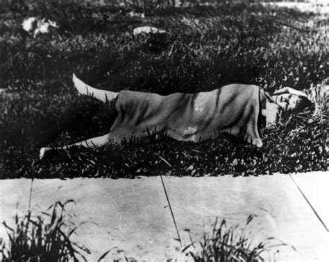 Black dahlia body. Elizabeth Short's body, as it was found 67 years ago today, except that it's covered by a blanket, hiding the fact that it had been cut in two at the waist. LA Public Library/Herald-Examiner Collection. Will Fowler (center) from the Los Angeles Examiner was one of the first reporters at the scene of the Black Dahlia murder. 