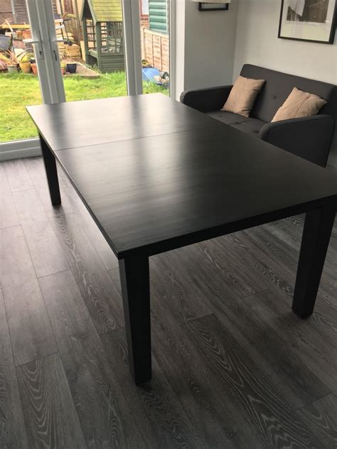 Black dining table, IKEA, Stornas in Cambridge, Cambridgeshire