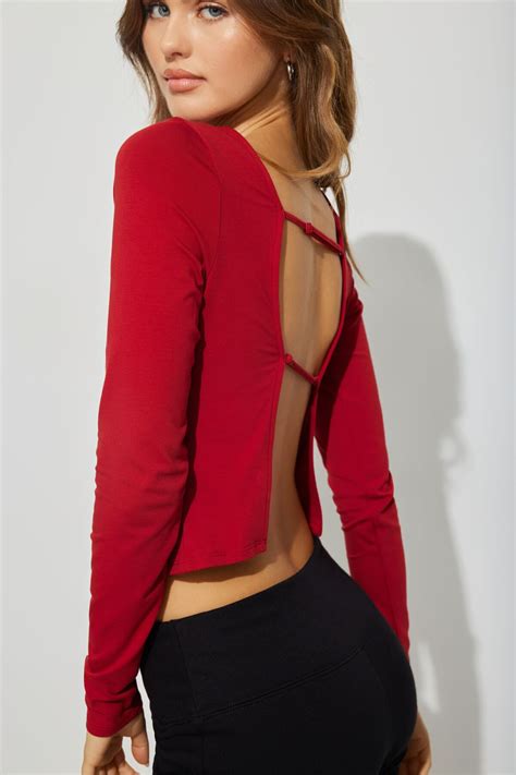 Black dress dynamite.  Features Boat neck Princess seams Open back Back Shop cirac...