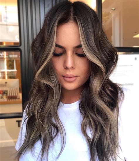 Jun 25, 2023 · Get wild for once and place short horizontal stripes of milky blond on black hair. Continue all over the head or mix your raccoon tails with some chunky highlights and money pieces. 5. Ashy Hues. Instagram / colouredbyad. Ash-blonde tones look good both on cool and warm skin tones. . 