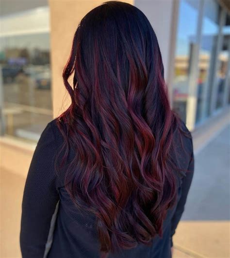 6. Juicy Plummy Red Balayage. This is another style that can be adapted to your skin tone and personal preference. Just make sure the different shades of plum complement each other, such as dark and light cool plum tones. Also, you can use this plum hair color on black strands. @mermeghair.