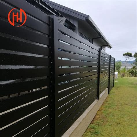 Black horizontal slat fence. .  ...