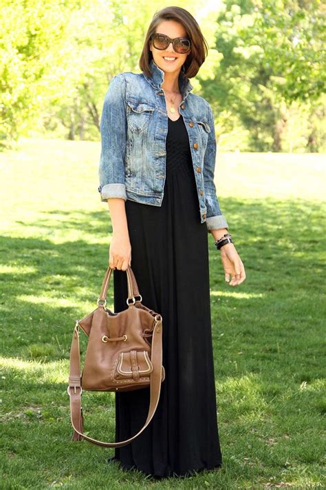 Black maxi dress with denim jacket on Stylevore