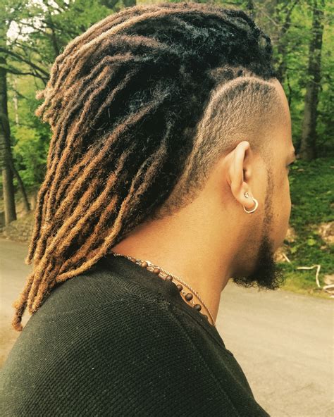 Black mens locs hairstyles. The most popular hair colors for bleached or dyed twists include blonde, platinum blonde, yellow, red, and blue. You can bleach the entire twist or just the tips for effect, and you can even choose to go with different hair colors. The sky is the limit with this one, and it’s great if you really want to stand out. 