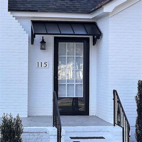 Black metal awning over door. NuImage Awnings. 1500 40-in Wide x 30-in Projection x 13-in Height Metal White Solid Fixed Door Awning. Color: Graystone. NuImage Awnings. 1100 72-in Wide x 54-in Projection x 20-in Height Metal Graystone Solid Fixed Door Awning. Color: Black. NuImage Awnings. 1500 72-in Wide x 42-in Projection x 16-in Height Metal Black Solid Fixed Door Awning. 