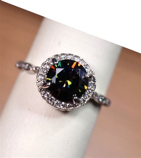 Black moissanite ring. Our Moissanite rings and other jewelry is rated A+ by BBB. Melina. $1,336. Moissanite Ring in 14k White Gold. Claudine. $2,127. Moissanite and Diamond Ring in 14k White Gold. Heavenly. $1,708. 