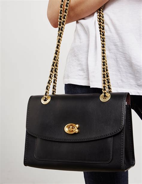 Black on black coach purse. Editor's Notes. Our 90sinspired Teri Shoulder Bag offers a detachable strap for crossbody wear, so you can switch it up to match any look. An inside pocket, two card slots and a ziptop closure secure your everyday essentials. 
