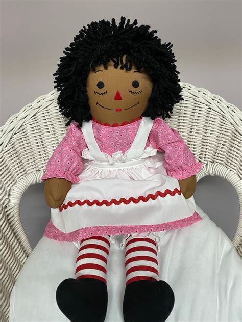 Black raggedy ann doll. Made by Aurora. Aurora Item#: 15441. 12”. CLICK HERE TO RECEIVE THE. FREE RAGGEDY ANN & ANDY NEWSLETTER. CLICK HERE TO JOIN OUR FAN CLUB PAGE ON FACEBOOK. For more information contact us via e-mail at: info@raggedyland.com. 
