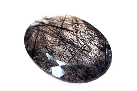 Black rutilated quartz. Rutilated quartz crystals are a type of quartz crystal that contain needles, plates, or fibers of rutile in the crystalline matrix. Rutile is a mineral composed mainly of titanium dioxide, and it is usually found within quartz as thin, black strands run through the stone. What are the healing properties of rutilated quartz? 