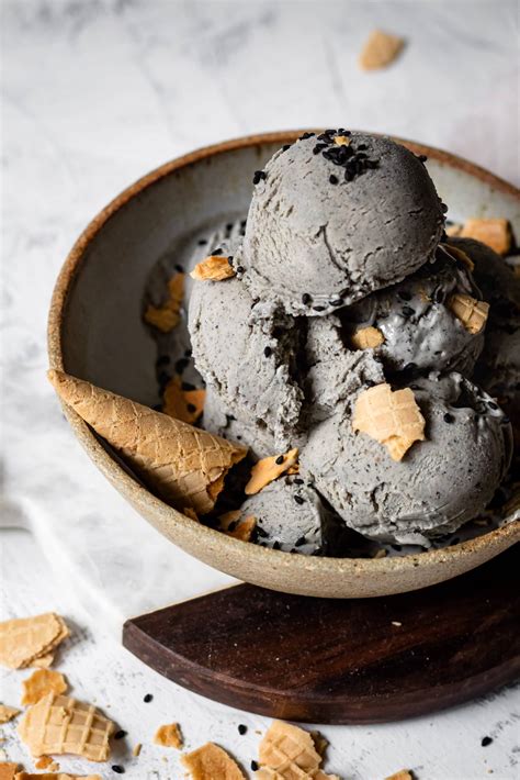 Black sesame ice cream. In a large dry pan over medium heat. Add black sesame seeds and toast, stirring for 3-4 minutes until fragrant. Remove from the pan and let them cool completely. In a high-speed blender, combine sesame seeds and Medjool dates. Blend until ground up and gritty. 