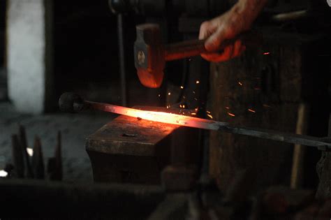 The word blacksmith refers to iron, which turns black when heated and exposed to oxygen, and the word smith which means “to strike.” A blacksmith is a type of metalworker who specializes in working with iron or steel by heating it up and striking it with a hammer to shape it.. 
