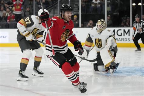 Blackhawks hand Vegas first loss of season with 4-3 win in overtime