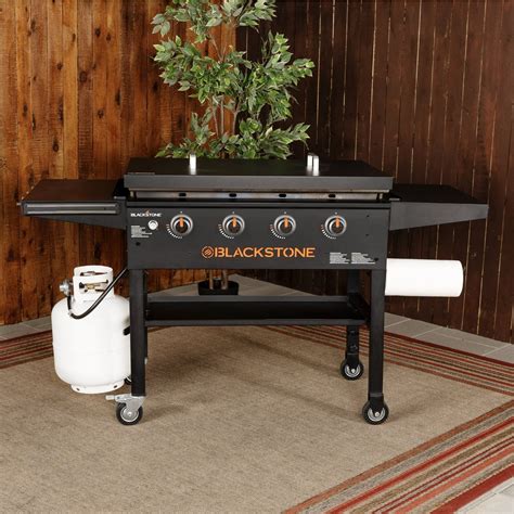 Top 3 Blackstone Grills. 1. Blackstone 28-inch Outdoor Flat Top Gas Grill. You can tell this Blackstone flat top grill gas is a quality grill for camping and small spaces from its high customer-rating and portable design that can be easily fit at the back of the car. This model is a two-burner flat top grill.. 