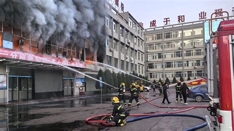 Blaze at a coal mine company building in northern China kills 19 and injures dozens