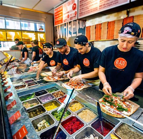 Blaze pizza. For best results, place a cookie sheet in your oven and preheat to 425 degrees. Remove your pizza from its box and place it in the oven on the preheated cookie sheet. Bake just until the cheese melts (about 2-3 minutes). Enjoy! 