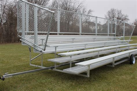 Bleechers. CB backrests are also designed for maximum fan safety and easy bleacher cleaning. One person can raise or lower up to seven interconnected backrests at a time, which minimizes labor and operational costs. Courtside XT seat spacers increase personal space by … 