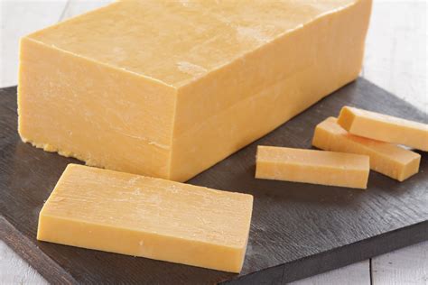 Block of cheese. It comes in a block, sometimes with added flavors, and spreads smoothly. The flavor is light and slightly tangy. Emmental . When people think of “Swiss cheese,” they’re likely thinking of Emmental (also known as Emmentaler). When the cheese’s curds are cooked and pressed together, bubbles form, which leave the holes in the cheese. 